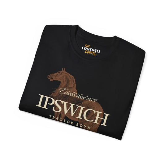 Folded black t-shirt with horse graphic and text on a white background
