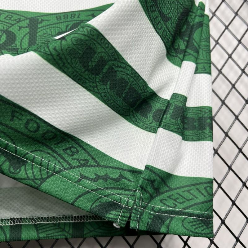Green and white striped Celtic 95-97 home shirt with a logo on a black mesh background