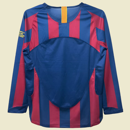 Blue and red striped Barcelona 05/06 champions league shirt  on a hanger with a white background