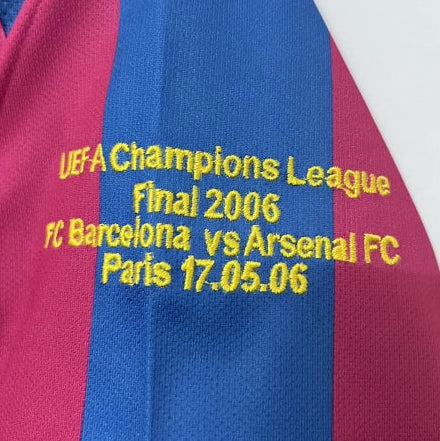 Close-up of a Barcelona 05/06 champions league shirt with text about the UEFA Champions League Final 2006 between FC Barcelona and Arsenal FC.