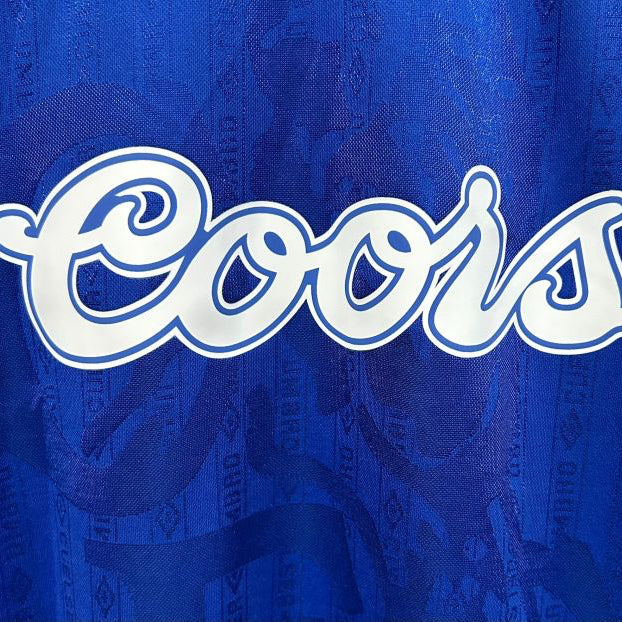Coors logo on a blue Chelsea 95-97 home shirt
