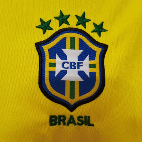 Brasilian sports team logo on a yellow Brazil 1998 home shirt