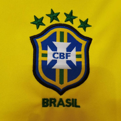 Brasilian sports team logo on a yellow Brazil 1998 home shirt