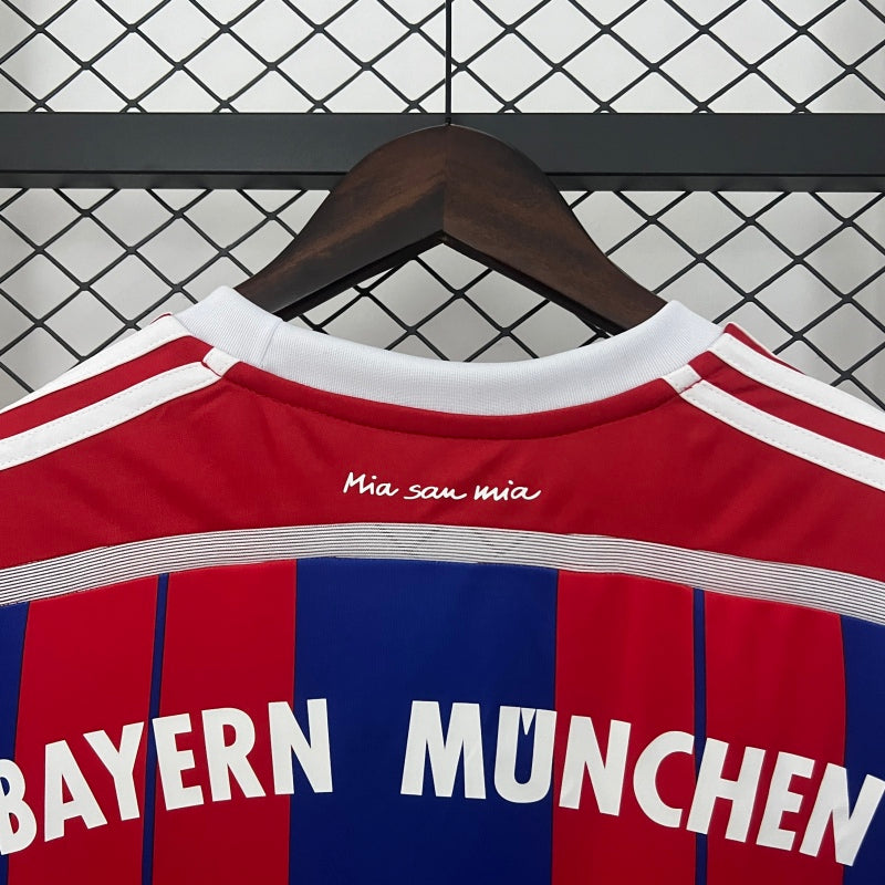 Bayern Munich jersey on a hanger against a chain-link fence background