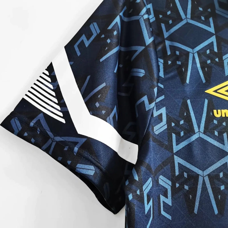 Blue and black patterned Scotland 1992 home shirt with a yellow logo on a white background