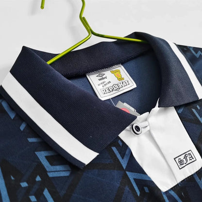 Navy and white Scotland 1992 home shirt with a brand label on a hanger