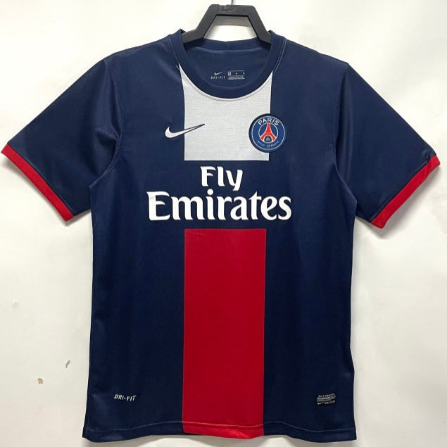 Paris Saint-Germain football jersey on a hanger against a white background
