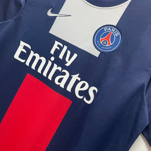 Paris Saint-Germain football jersey with Nike logo on a hanger