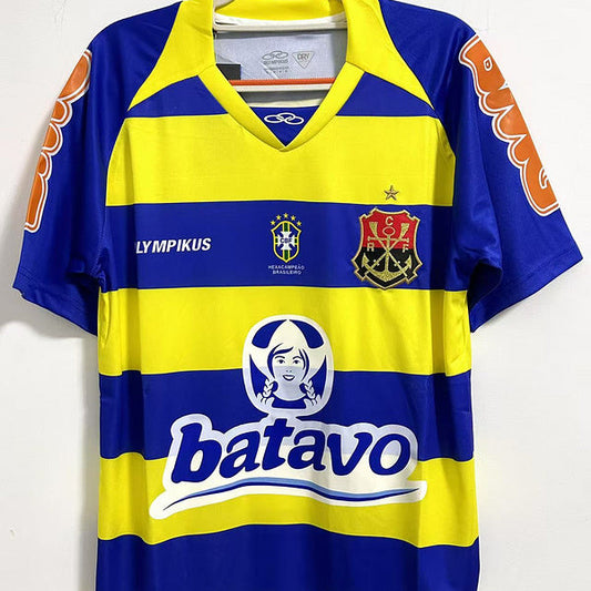 Yellow and blue Flamengo 2010 third shirt  with branding on a white background