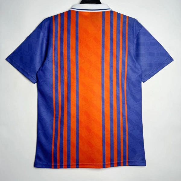 PSG 93/94 home shirt on a hanger against a white background