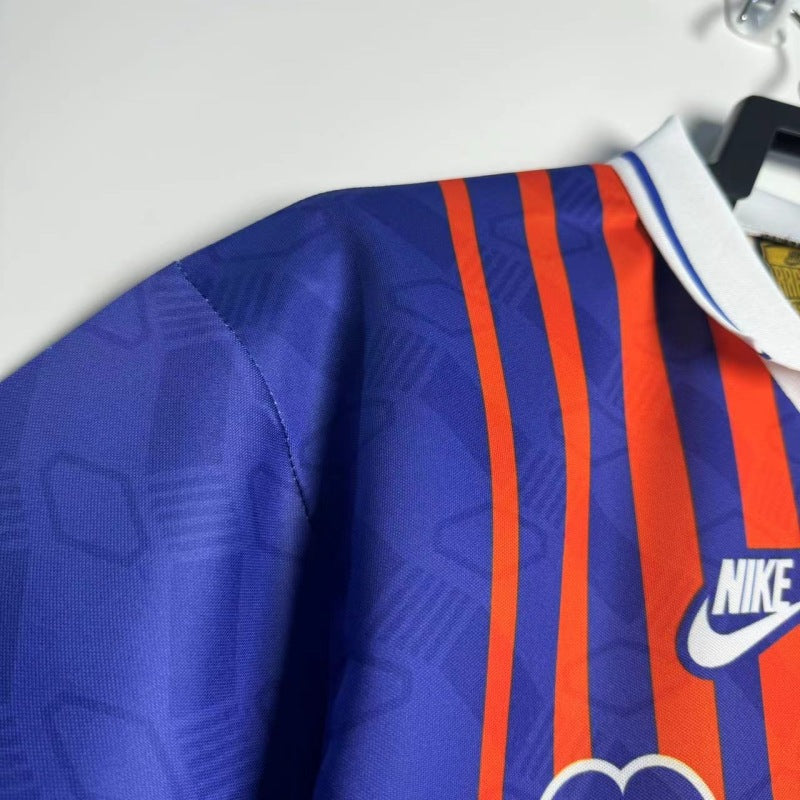 PSG 93/94 home shirt with Nike logo on a hanger