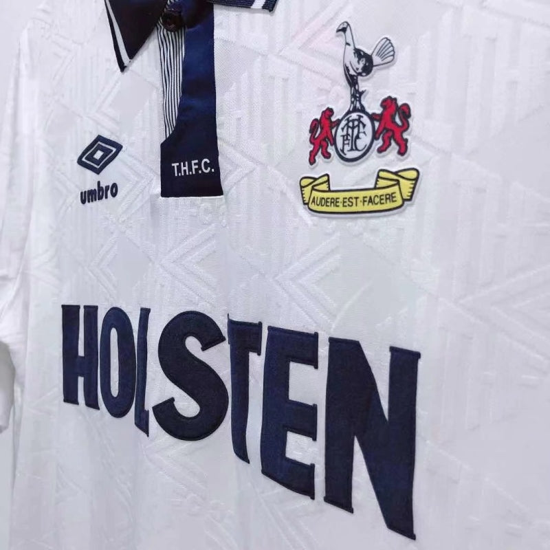 White Tottenham 91-93 home shirt with branding and text, featuring a prominent 'Holsten' logo.