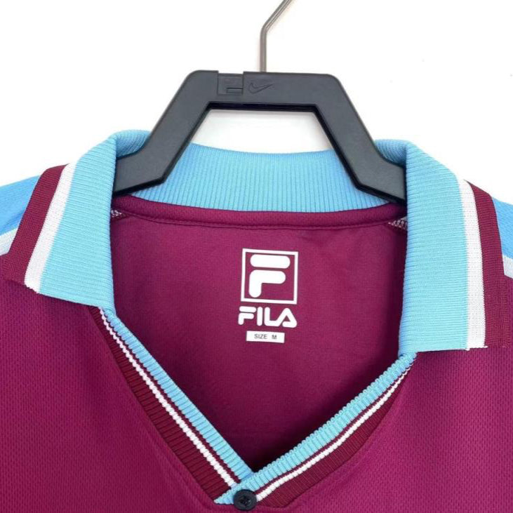 Maroon West Ham 99/01 home shirt with light blue collar and white logo on a hanger