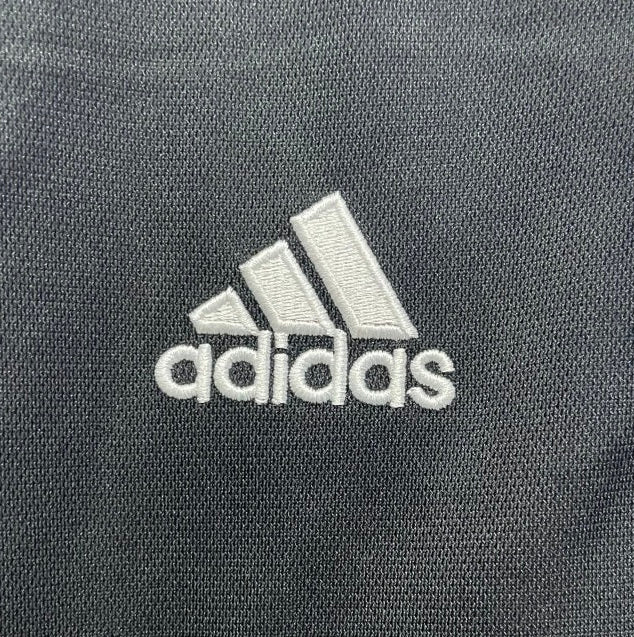 Close-up of Adidas logo on a Newcastle 00/01 away shirt