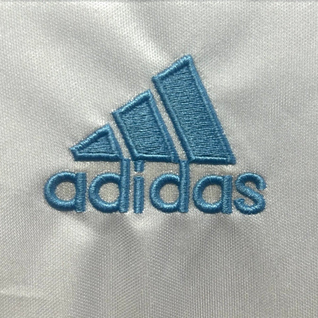Adidas logo on a Marseille 03/04 home shirt