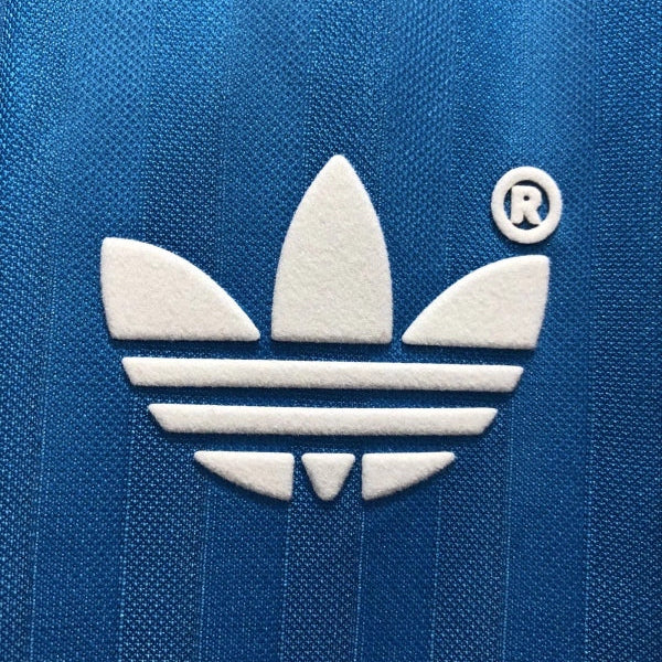 White Adidas logo on a blue Marseille 90/91 away shirt