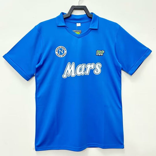 Blue Napoli 88/89 home shirt with 'Mars' branding on a hanger against a white background