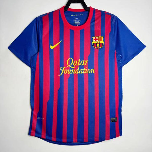 Blue and red striped Barcelona 11/12 home shirt with Nike logo on a white background