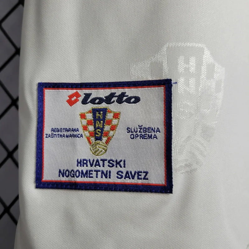 Lotto logo on a Croatia 1998 home shirt  with text in Croatian