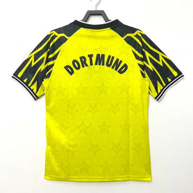 Yellow Dortmund 94/95 home shirt  with black accents and 'Dortmund' text on a white background