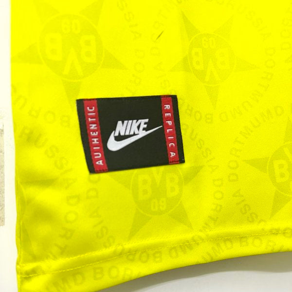 Yellow Dortmund 94/95 home shirt  with a Nike replica label on a white background