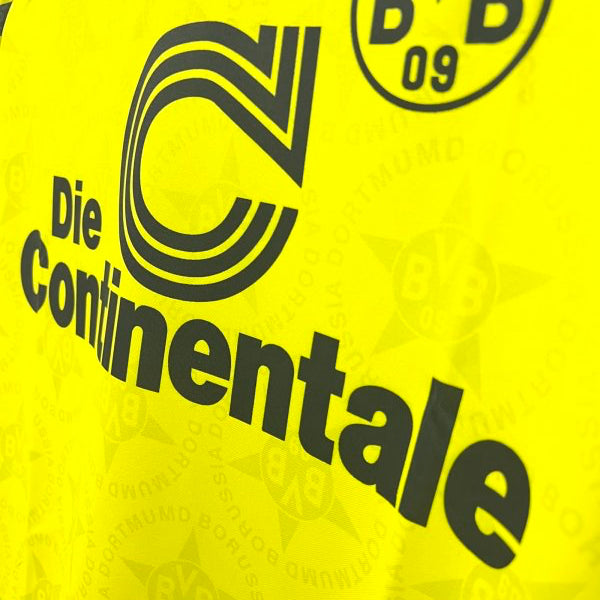 Yellow Dortmund 94/95 home shirt  with black text and logos, including 'BVB' and 'Die Continentale'.