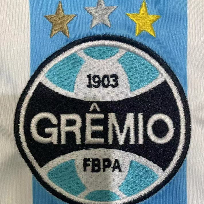Embroidered patch of A Gremio FBPA on a Gremio 2000 home shirt 