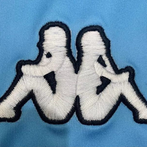 Embroidered Kappa logo patch on a Gremio 2000 home shirt 