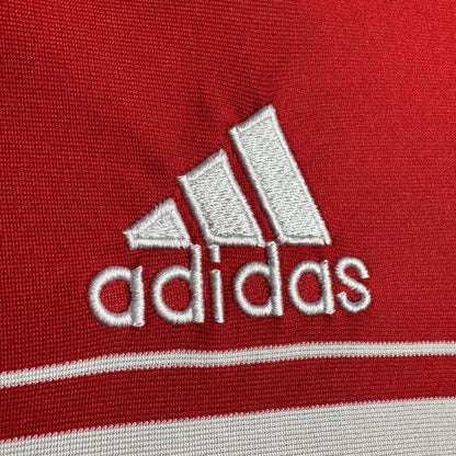 Close-up of Adidas logo on a red Bayern Munich 07/08 home shirt