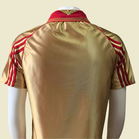 Gold Benfica 98/99 away shirt  with red stripes on a mannequin against a gray background