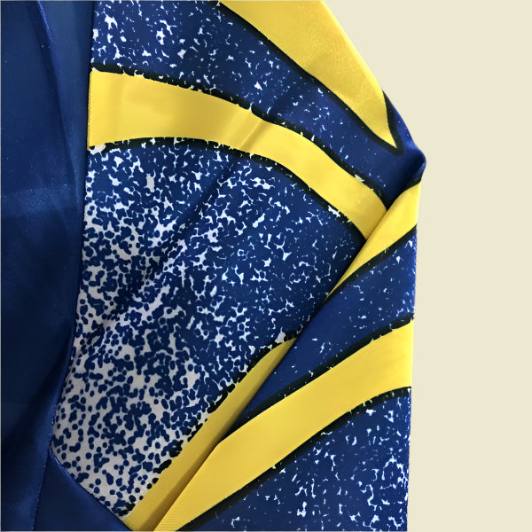 Close-up of a blue and yellow Parma 95/96 third Shirt with a patterned design.