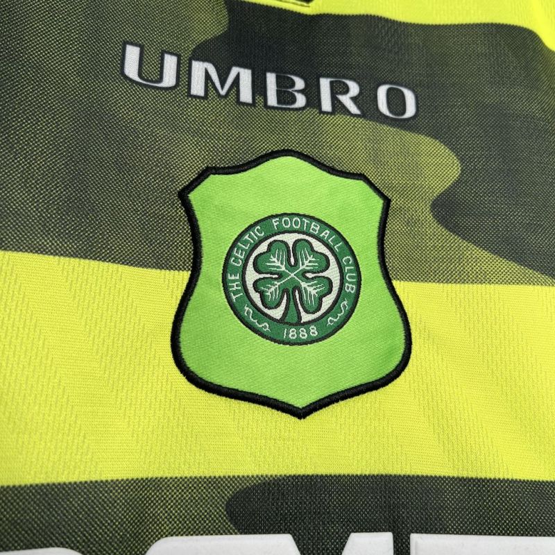 Green and yellow Celtic 96/97 away kit with Celtic FC logo and Umbro branding.