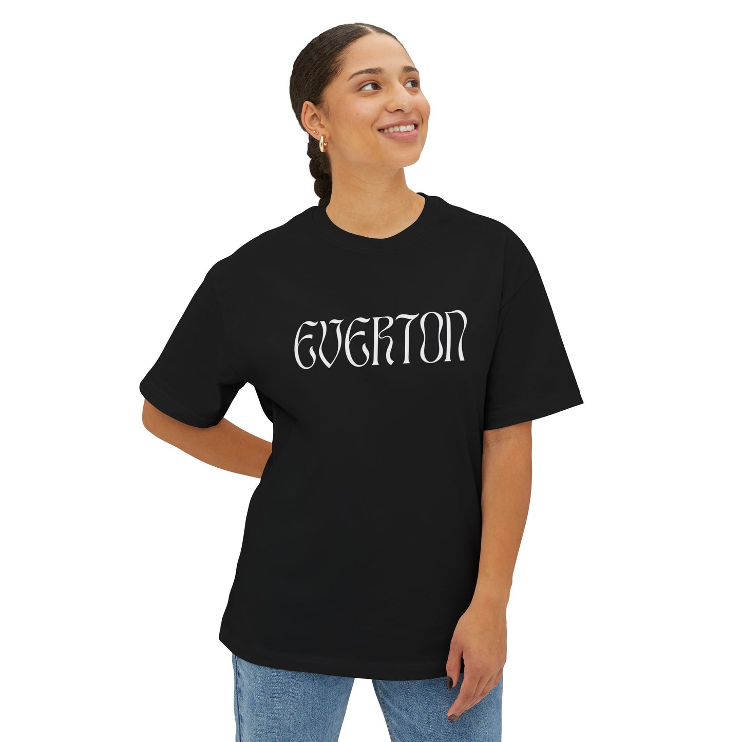 Person wearing a black t-shirt with 'Everton' printed on it against a white background