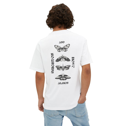 Person wearing a white t-shirt with butterfly designs and text on the back, standing against a white background.
