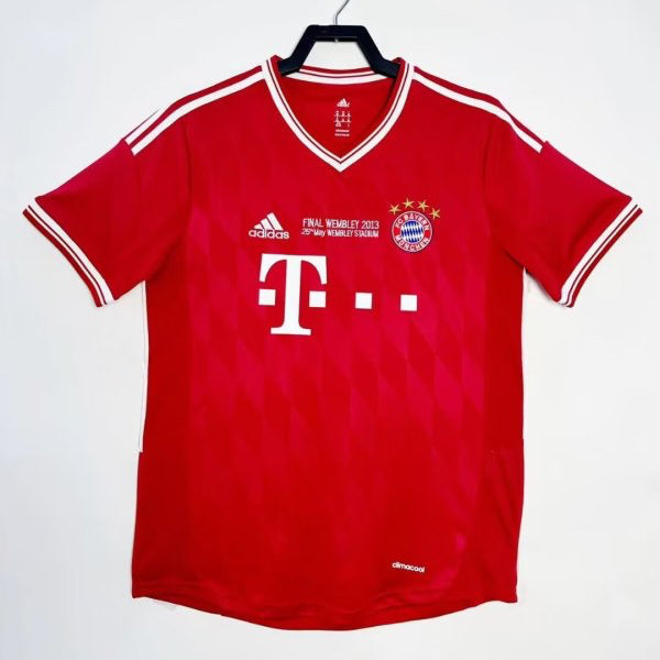 Red Bayern Munich 13 champions league final shirt with white accents on a hanger against a white background