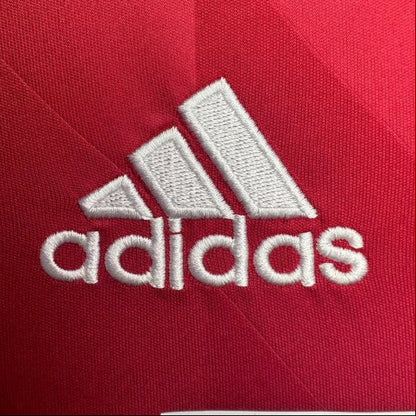 White Adidas logo on a red Bayern Munich 13 champions league final shirt