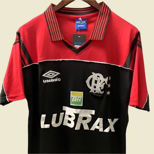 Red and black Flamengo 1999 gk away shirt with visible branding on a gray background