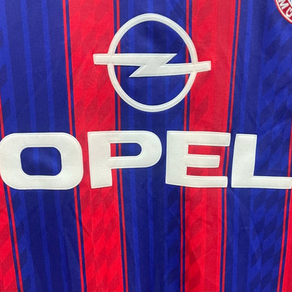 Opel logo on a red and blue striped Bayern Munich 95-97 home shirt