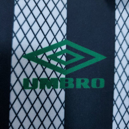 Close-up of Umbro logo on a Celtic 95/96 away shirt  with grid pattern