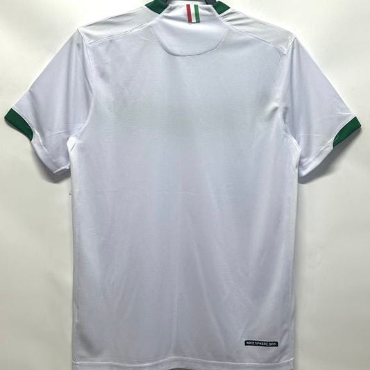 White Mexico 2006 away shirt with green accents on a hanger against a white background