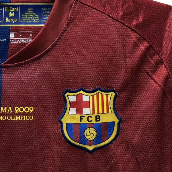 Barcelona 09 champions league final shirt  with FCB logo and text, close-up view.