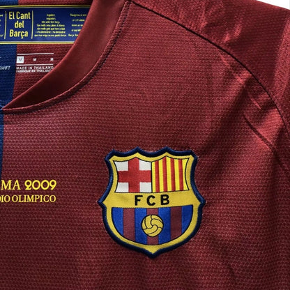 Barcelona 09 champions league final shirt  with FCB logo and text, close-up view.