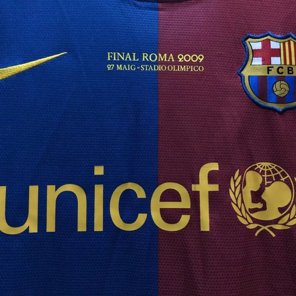 Close-up of a Barcelona football jersey with Unicef logo and text