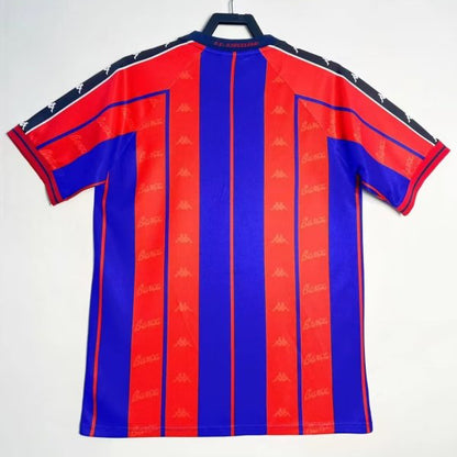 Red and blue striped Barcelona 97/98 home shirt on a hanger against a white background