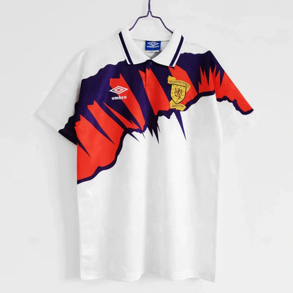 White scotland 1992 away shirt with red and purple design, featuring an Umbro logo, on a white background.