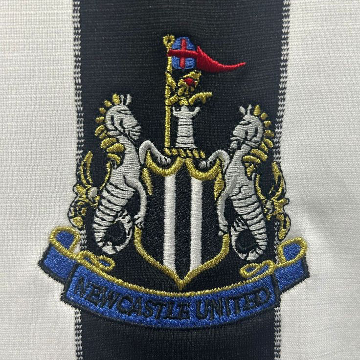 Embroidered crest of Newcastle United on a Newcastle 00/01 home shirt