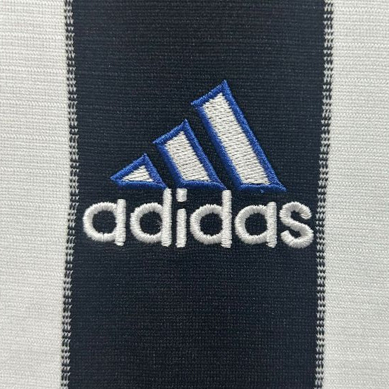 Adidas logo on a Newcastle 00/01 home shirt