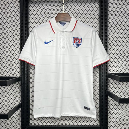 White USA 2014 home shirt with Nike logo and USA flag on a hanger against a grid background