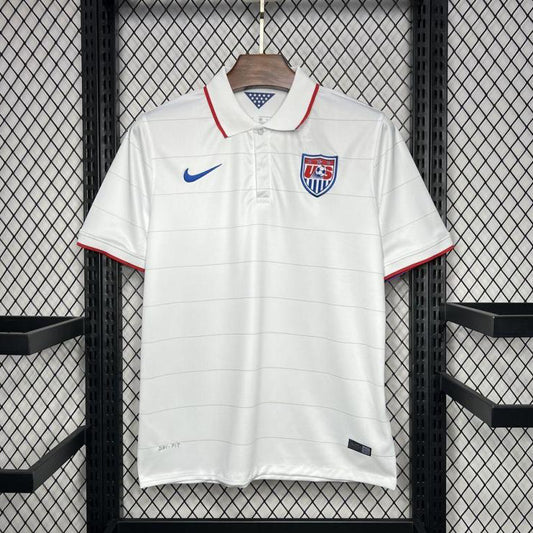 White USA 2014 home shirt with Nike logo and USA flag on a hanger against a grid background
