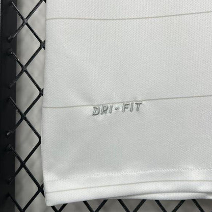 White USA 2014 home shirt with 'Dri-Fit' logo on a black grid background